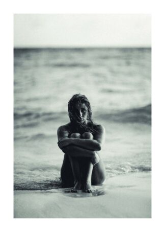 Girl sitting in the beach black and white poster